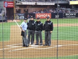 Four umpires at work: Left to right: Chris Guccione, Brian O’Nora, Phil Cuzzi, and Jerry Crawford